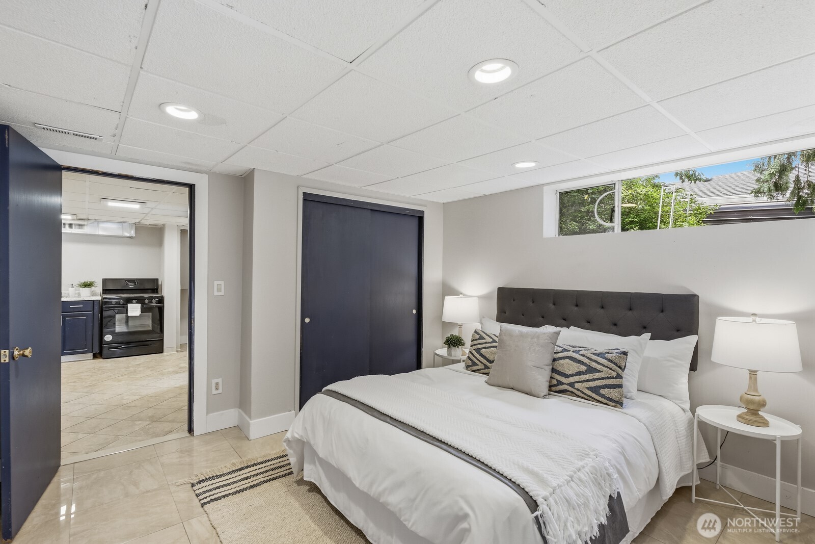 3822 Shelby Road Lynnwood, WA 98087 - Photo 28 of 40 a bedroom with a bed and a large mirror