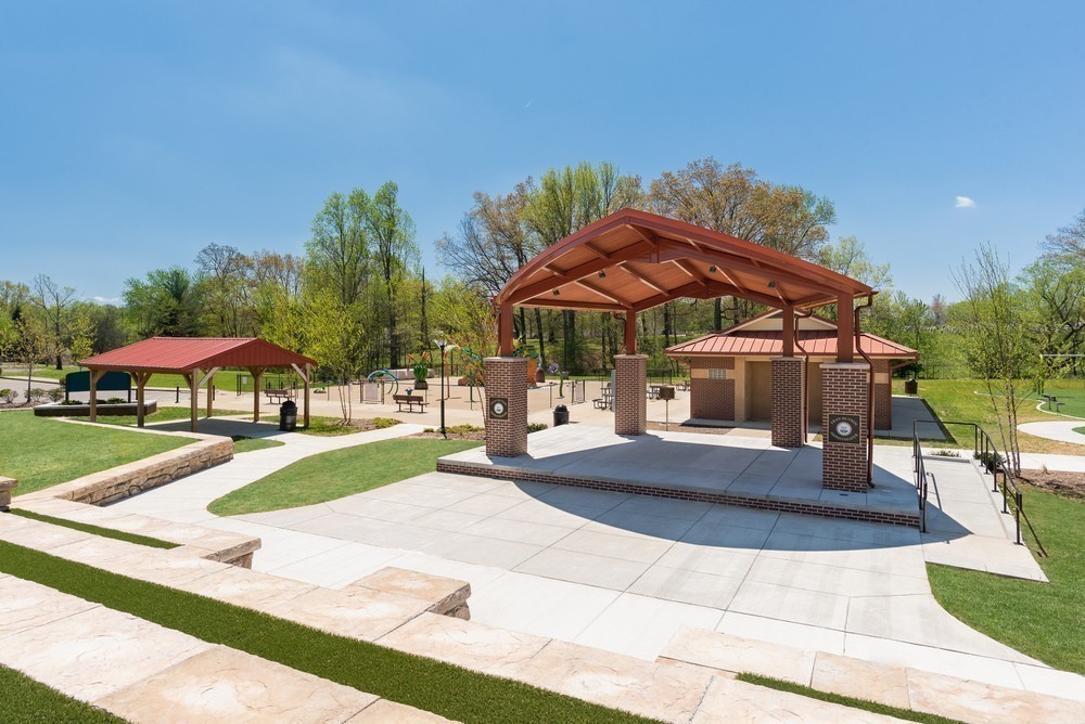 607 Streamview Drive White House, TN 37188 - Photo 14 of 21 a view of a patio with a table and chairs under an umbrella