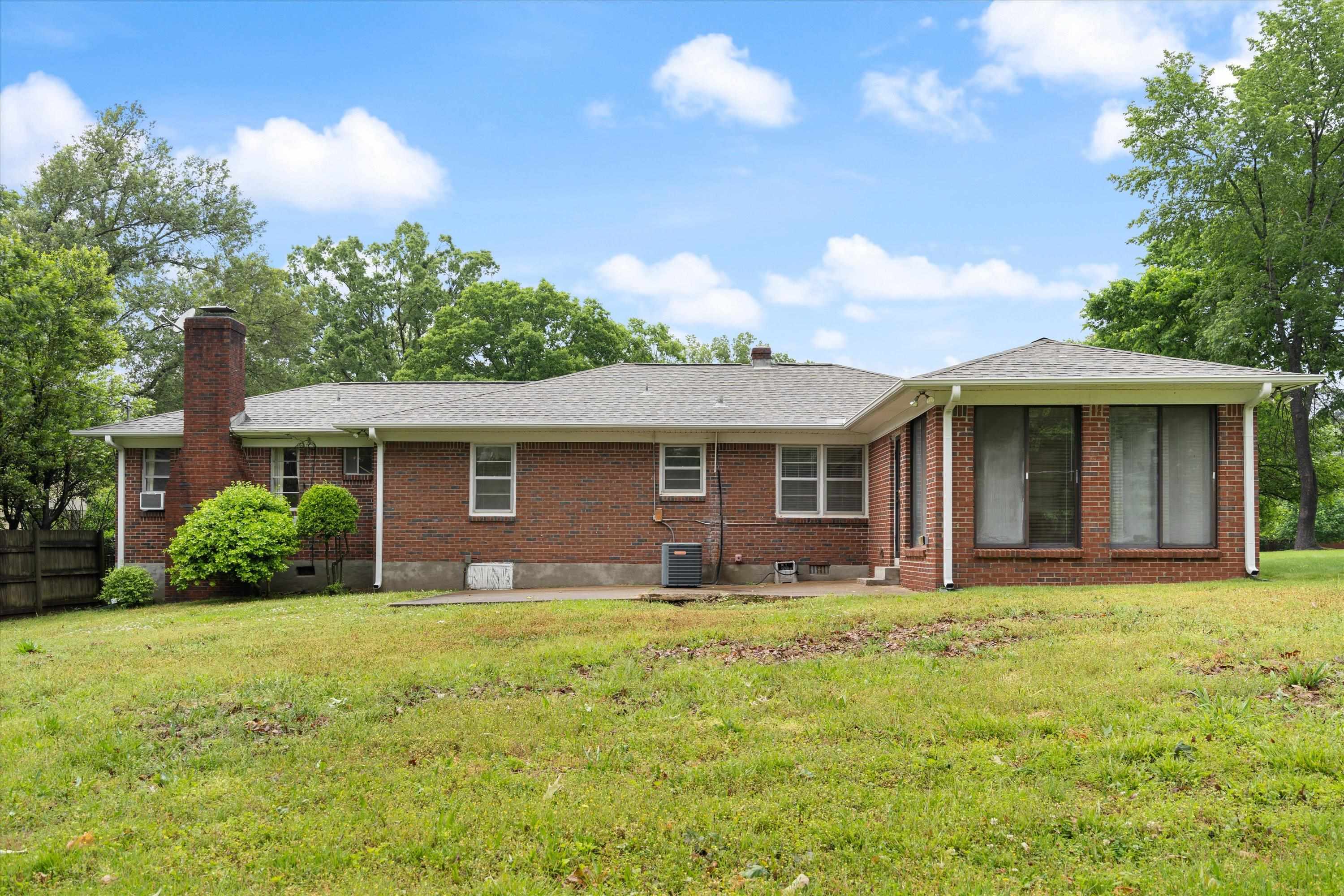 5285 Normandy Road Memphis, TN 38120 - Photo 3 of 7 a front view of a house with yard and green space