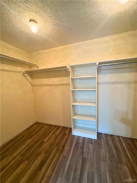 1614 Grovewood Road Mission, TX 78573 - Photo 13 of 25 a view of walk in closet with empty racks