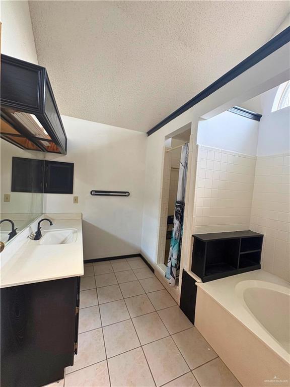 1614 Grovewood Road Mission, TX 78573 - Photo 16 of 25 a bathroom with a bathtub sink and toilet