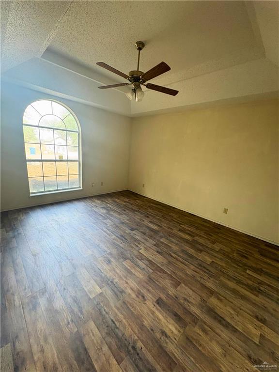 1614 Grovewood Road Mission, TX 78573 - Photo 17 of 25 an empty room with wooden floor fan and windows