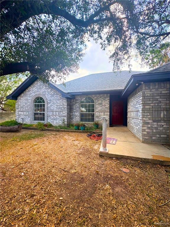 1614 Grovewood Road Mission, TX 78573 - Photo 2 of 25 a house with trees in the background