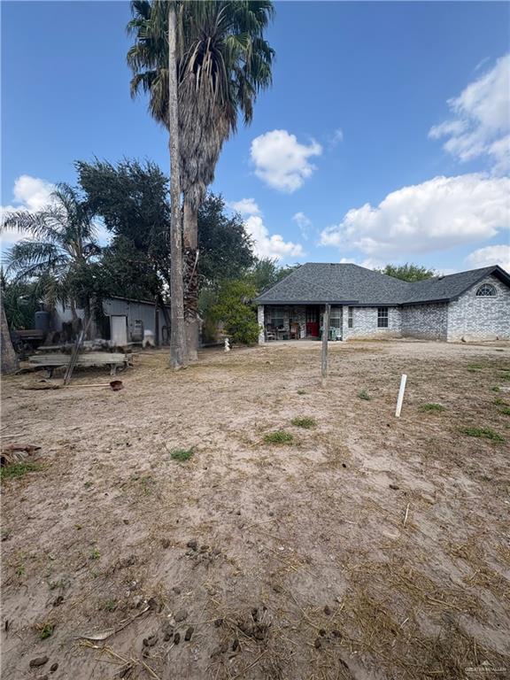 1614 Grovewood Road Mission, TX 78573 - Photo 24 of 25 a view of a house with a yard