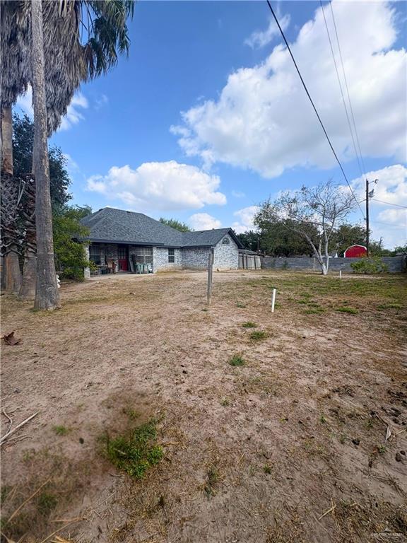 1614 Grovewood Road Mission, TX 78573 - Photo 25 of 25 a view of a house with a yard