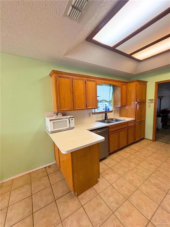 1614 Grovewood Road Mission, TX 78573 - Photo 6 of 25 a kitchen with stainless steel appliances a sink a counter top space and a window