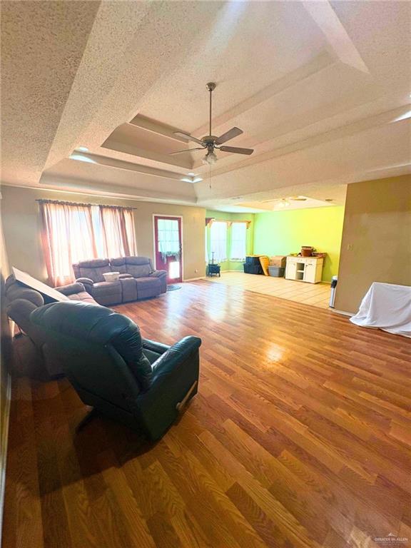 1614 Grovewood Road Mission, TX 78573 - Photo 8 of 25 a living room with furniture and a chandelier