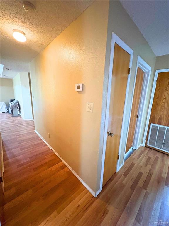 1614 Grovewood Road Mission, TX 78573 - Photo 10 of 25 a view of a hallway with wooden floor