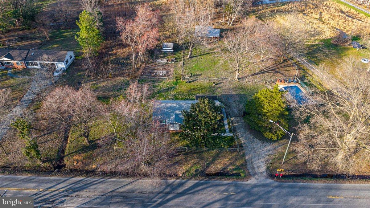 2505 West Denneys Road Dover, DE 19904 - Photo 7 of 68 Sprawling greenery surrounds a charming home.