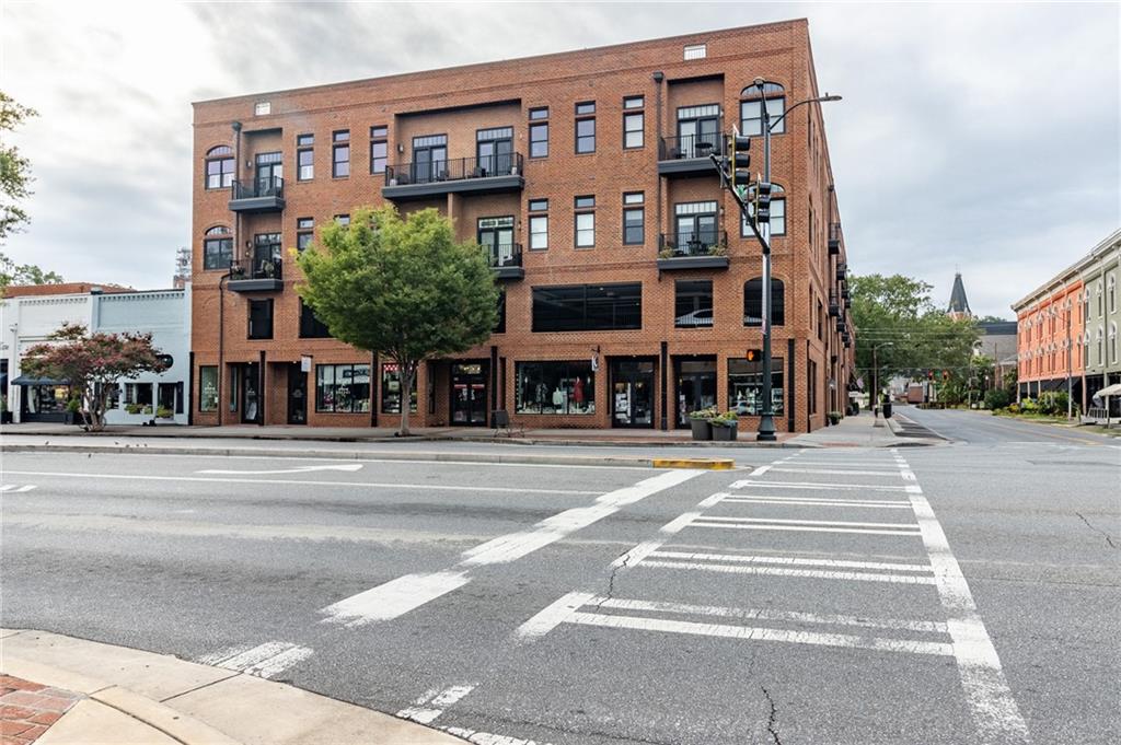 1 East 3rd Avenue, Unit 311 Rome, GA 30161 - Photo 1 of 1 a front view of a building and a street