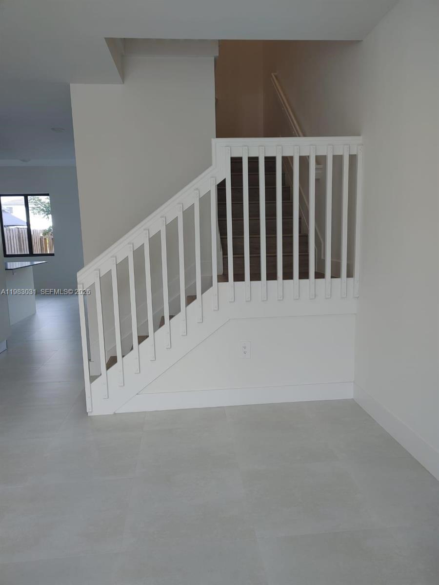 18983 Southwest 345th Terrace Homestead, FL 33034 - Photo 11 of 33 a view of staircase with rug