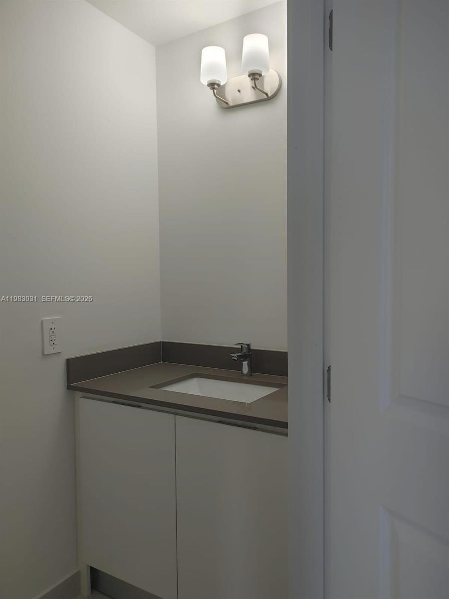 18983 Southwest 345th Terrace Homestead, FL 33034 - Photo 14 of 33 a bathroom with a sink and vanity