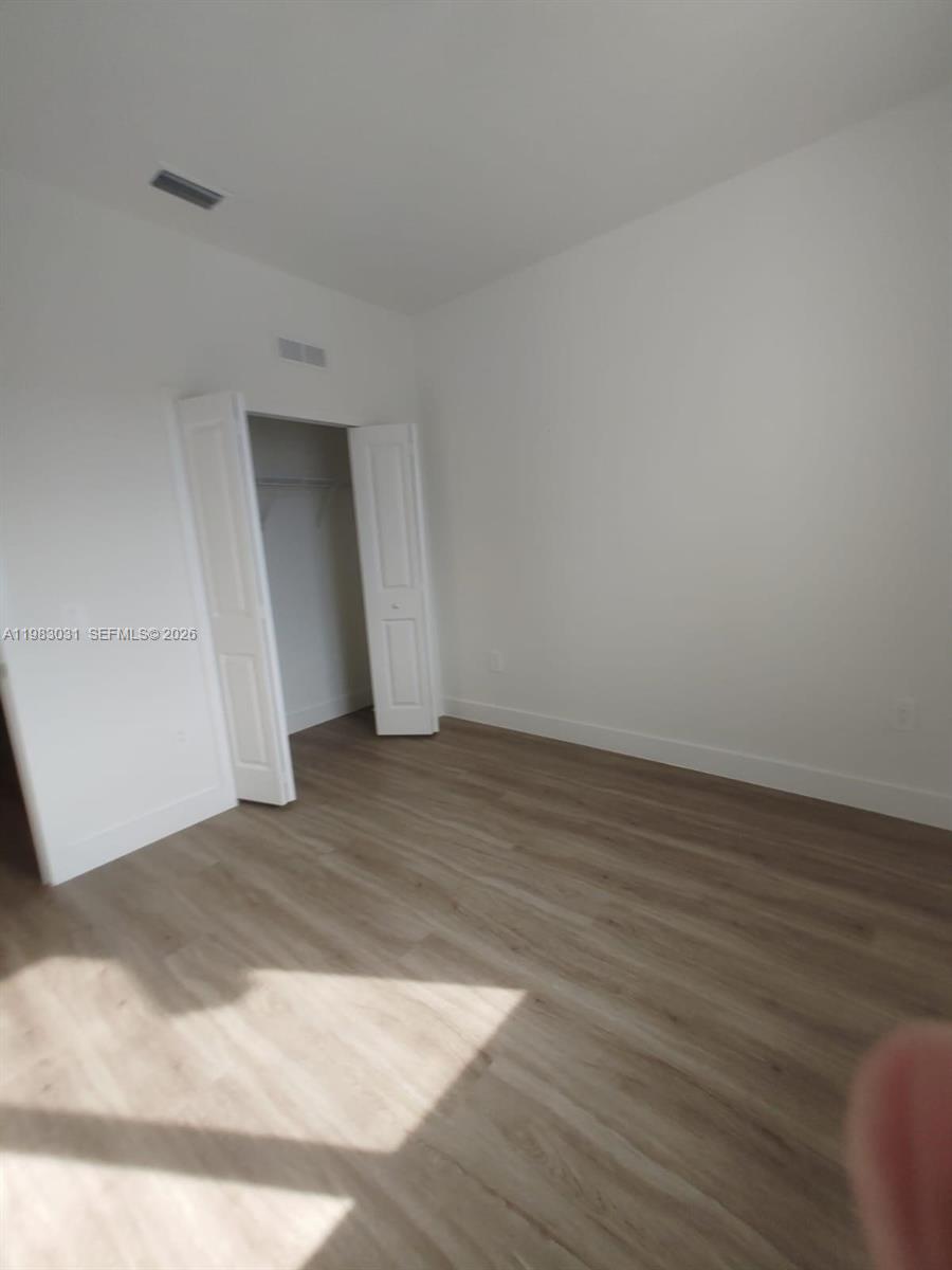 18983 Southwest 345th Terrace Homestead, FL 33034 - Photo 23 of 33 a view of a room with wooden floor