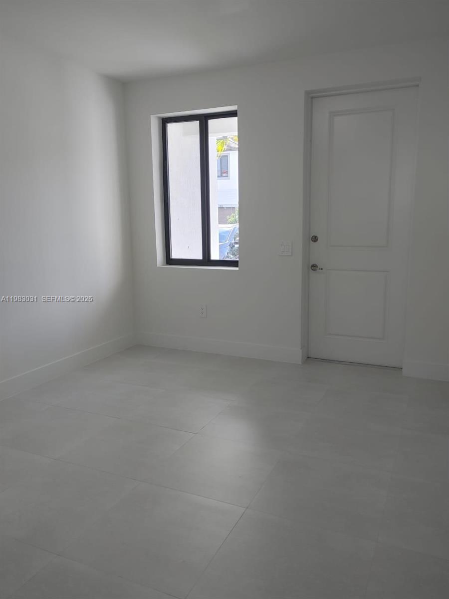 18983 Southwest 345th Terrace Homestead, FL 33034 - Photo 10 of 33 an empty room with windows