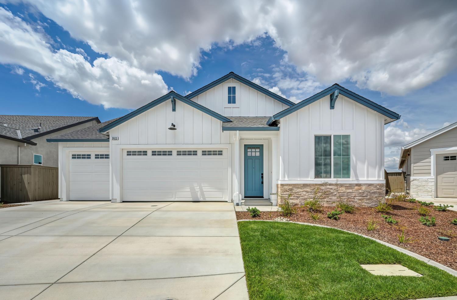 3922 Buxus Road Rocklin, CA 95765 - Photo 2 of 11 a front view of a house with a yard and garage