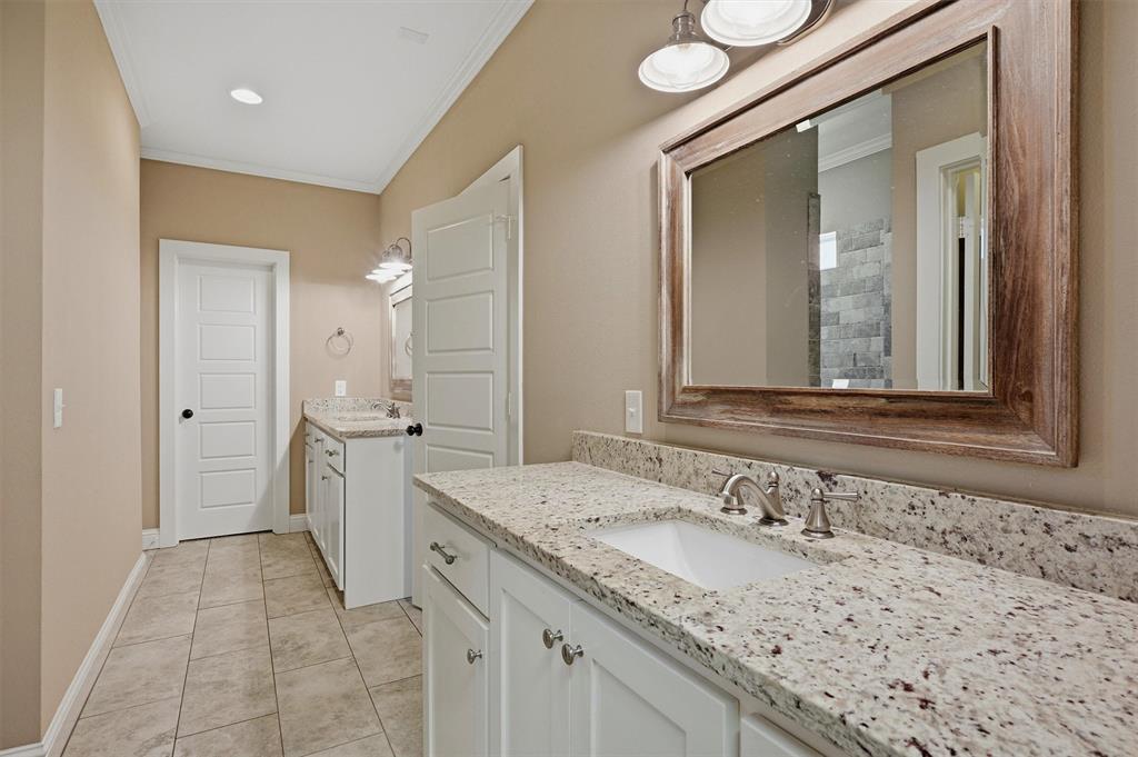 662 Preakness Place Road Van Alstyne, TX 75495 - Photo 17 of 39 a bathroom with a granite countertop sink and a mirror