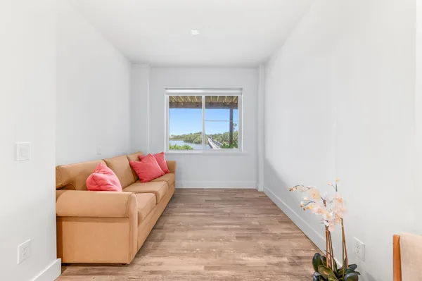 a living room with furniture and a rug