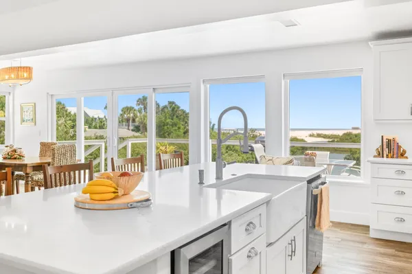 a kitchen with a sink and large window