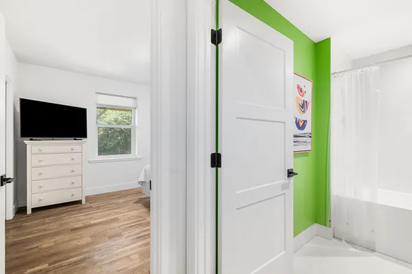 a view of an entryway with wooden floor