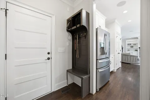 a view of hallway with wooden floor