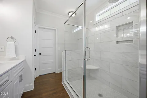 a bathroom with a shower and a sink
