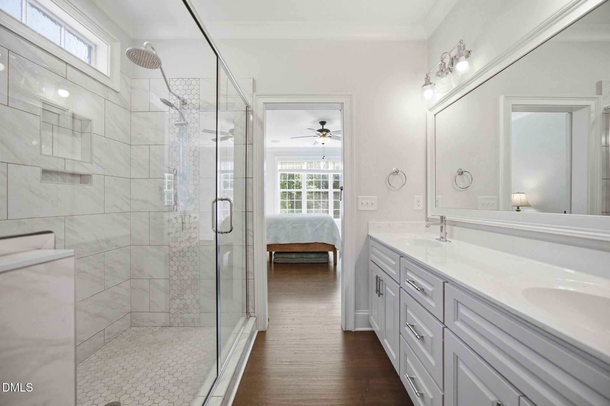 211 Long Street Fuquay-Varina, NC 27526 - Photo 18 of 38 a bathroom with a double vanity sink a toilet and a shower