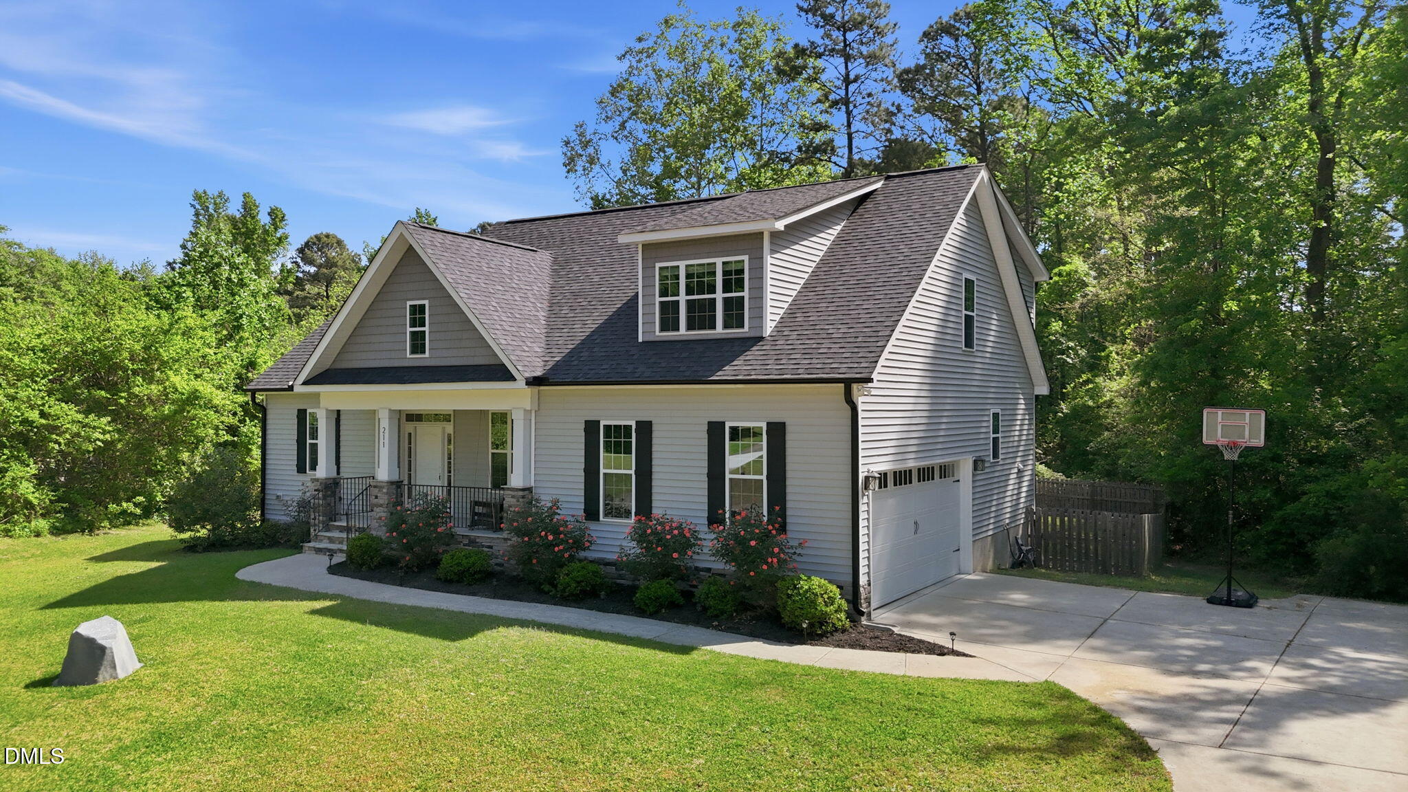211 Long Street Fuquay-Varina, NC 27526 - Photo 2 of 38 a front view of a house with a yard and garage