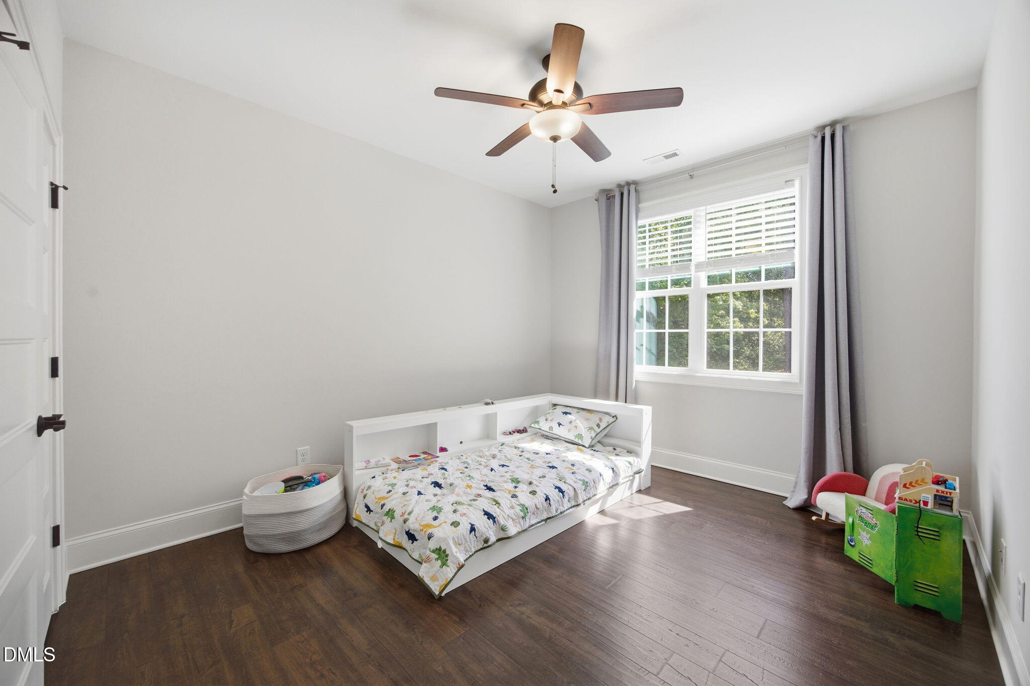 211 Long Street Fuquay-Varina, NC 27526 - Photo 23 of 38 a bedroom with bed and a window