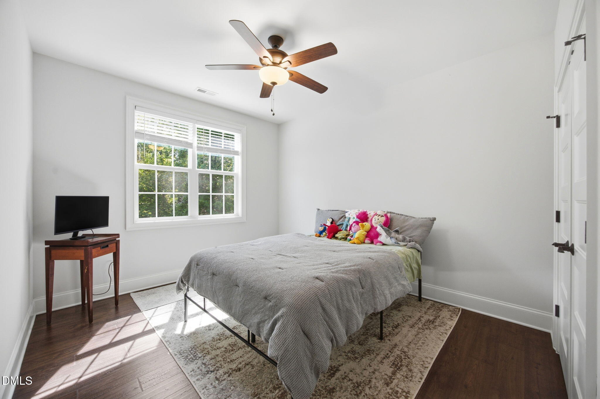 211 Long Street Fuquay-Varina, NC 27526 - Photo 24 of 38 a bedroom with a bed and a window