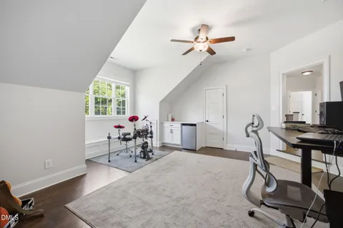 a living room with furniture a air conditioner and a window