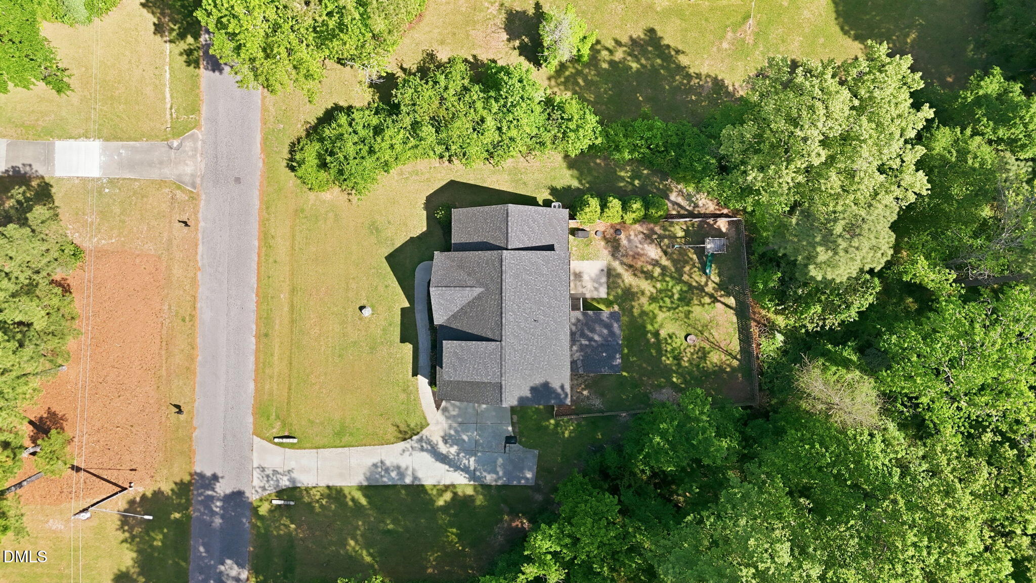 211 Long Street Fuquay-Varina, NC 27526 - Photo 33 of 38 an aerial view of a house with a yard and swimming pool