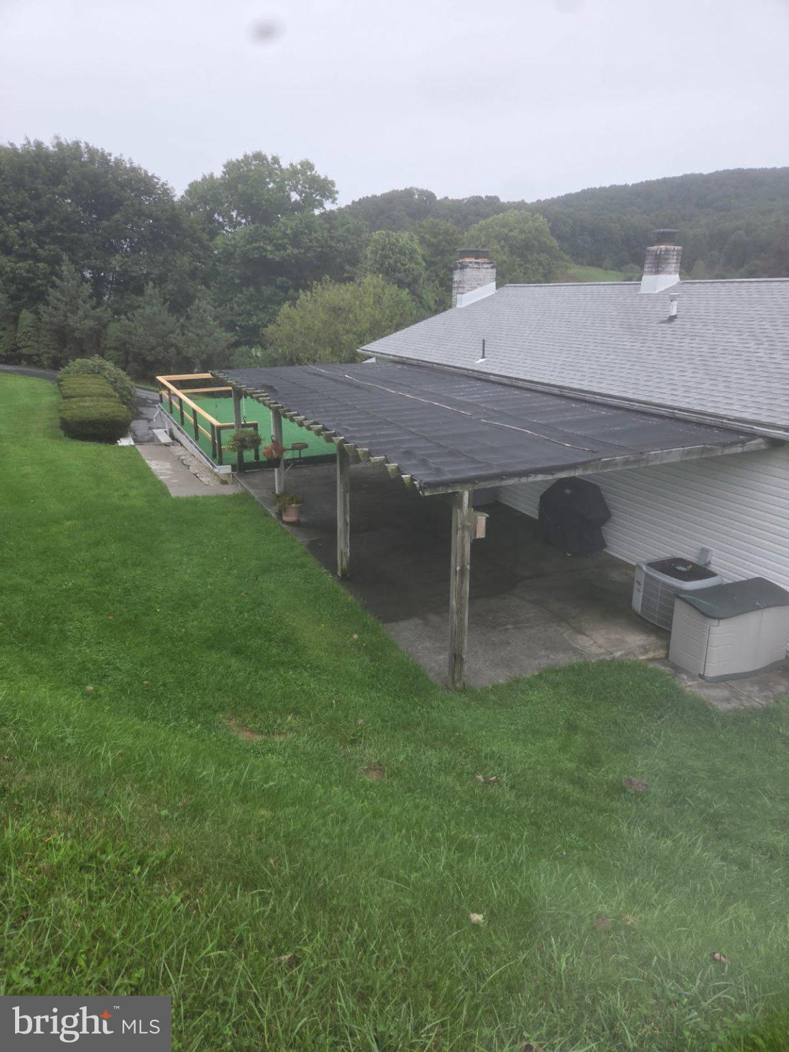 7620 Spring Road New Bloomfield, PA 17068 - Photo 41 of 45 REAR COVERED PORCH