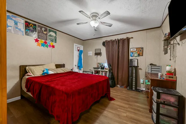 a bed room with a bed and a flat screen tv