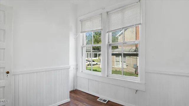 a bathroom with a window and a shower