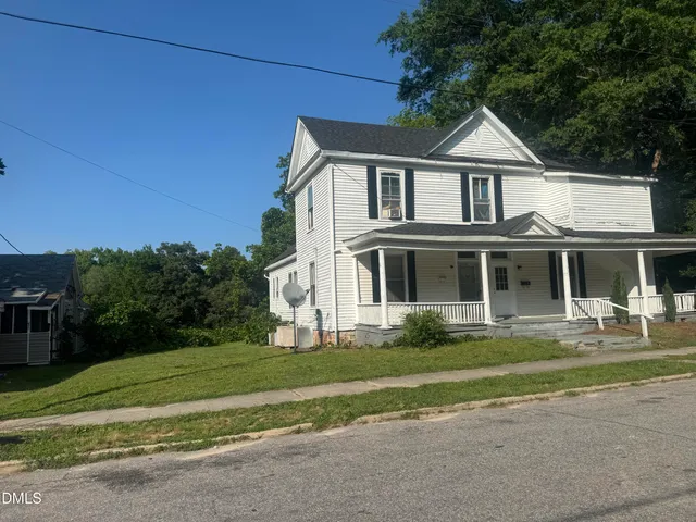 a picture of a bench in front of a wall