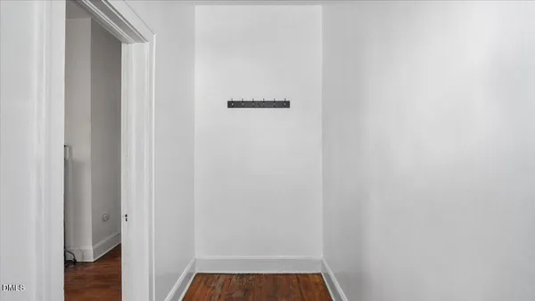 a picture of a bench in front of a wall