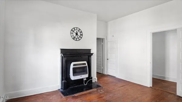 a view of a livingroom with furniture and a window