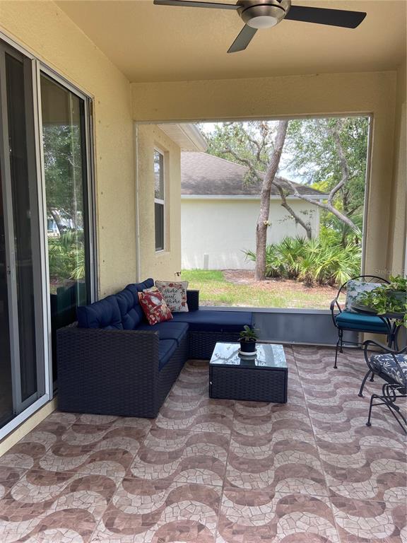 11248 Mollymawk Court New Port Richey, FL 34654 - Photo 16 of 21 a living room with furniture and a large window