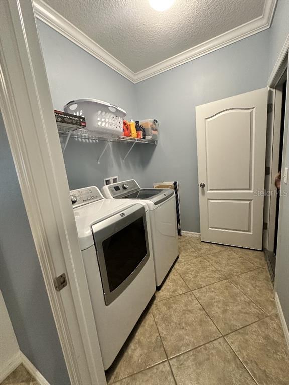 11248 Mollymawk Court New Port Richey, FL 34654 - Photo 8 of 21 a utility room with dryer and washer