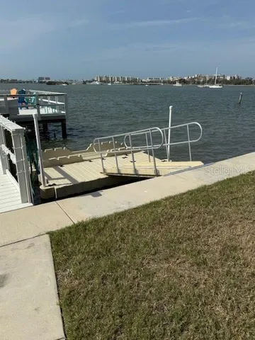 a roof deck with table and chairs