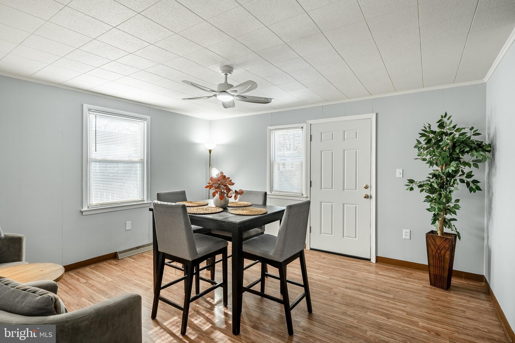 8 Garrett Road Wilmington, DE 19809 - Photo 11 of 37 a view of a livingroom with furniture and a potted plant