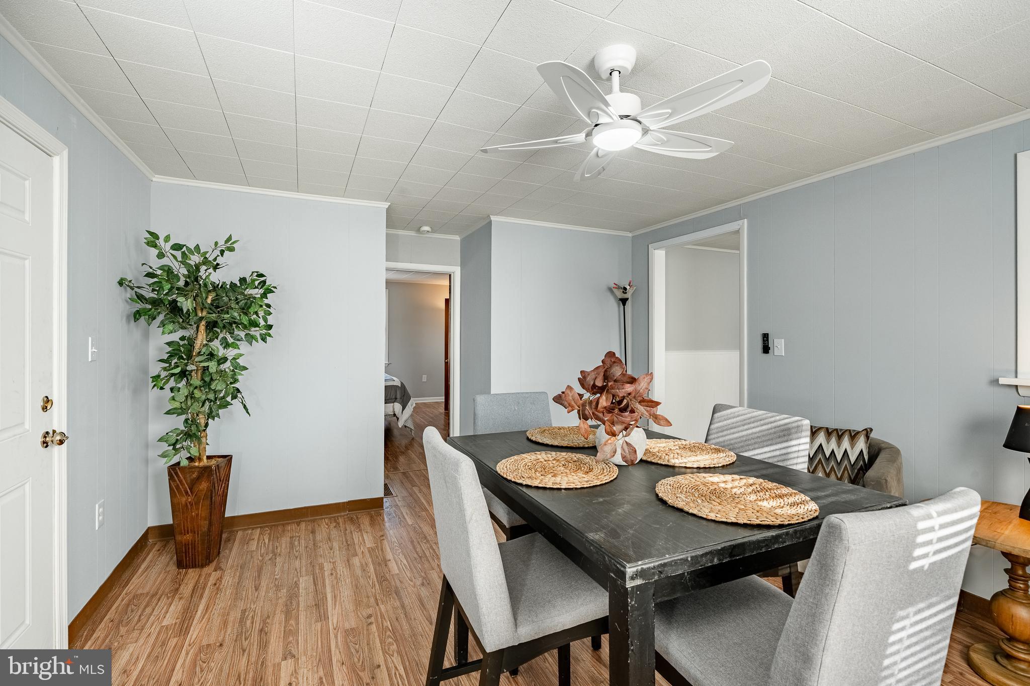 8 Garrett Road Wilmington, DE 19809 - Photo 13 of 37 a view of a dining room with furniture and wooden floor