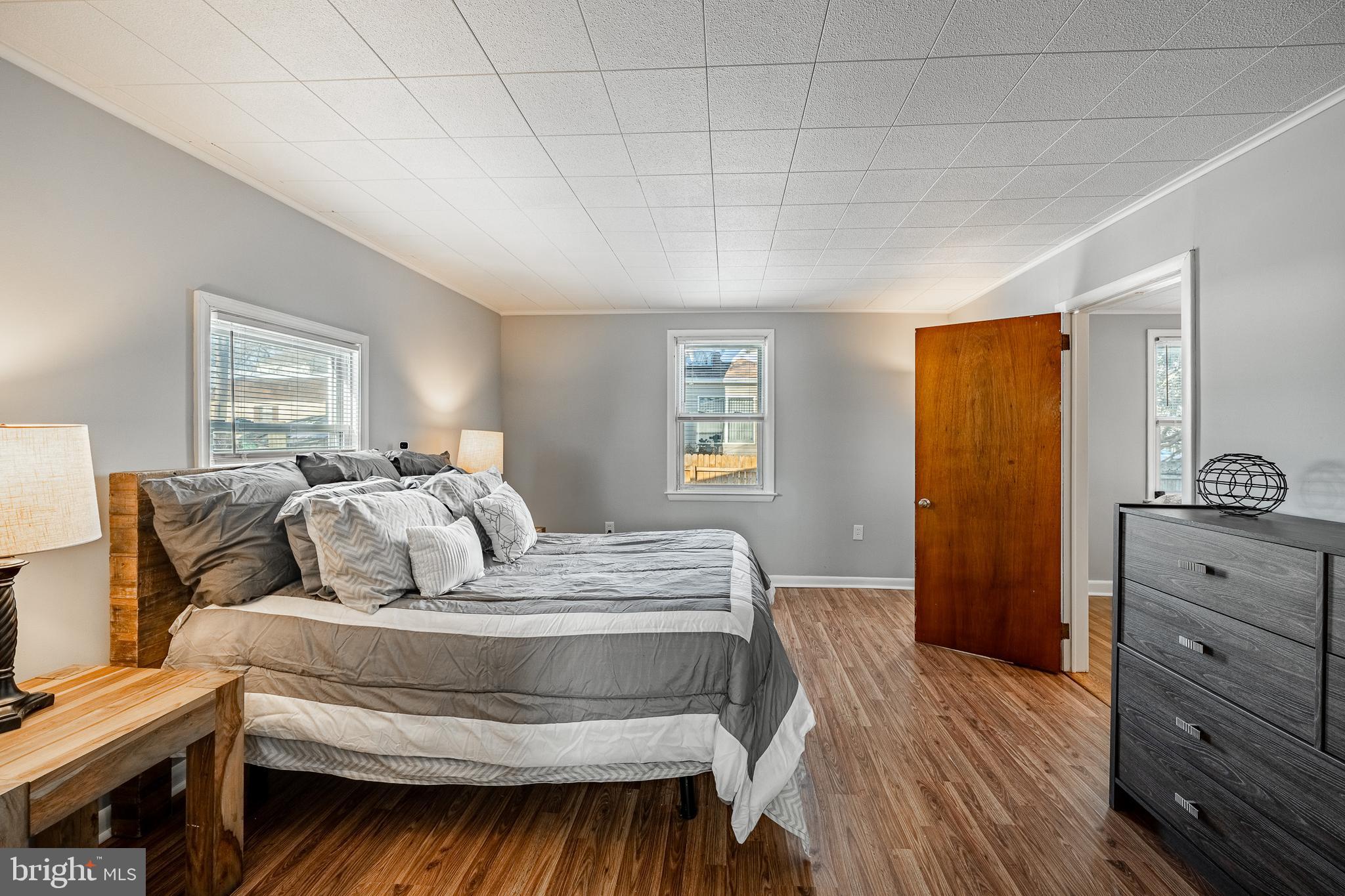 8 Garrett Road Wilmington, DE 19809 - Photo 15 of 37 a bedroom with a bed and wooden floor
