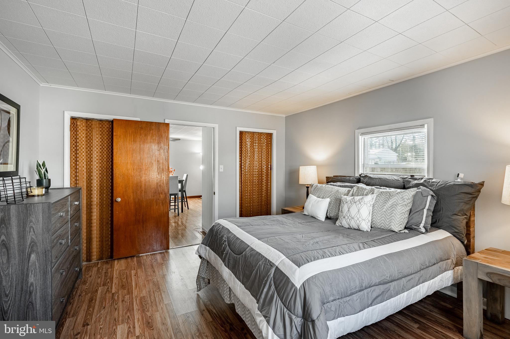 8 Garrett Road Wilmington, DE 19809 - Photo 16 of 37 a bedroom with a bed and wooden floor