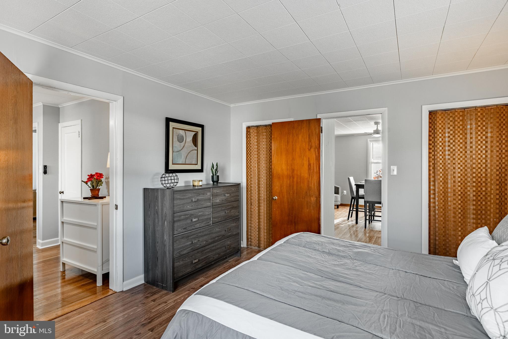 8 Garrett Road Wilmington, DE 19809 - Photo 17 of 37 a room with a bed and a mirror on the dresser
