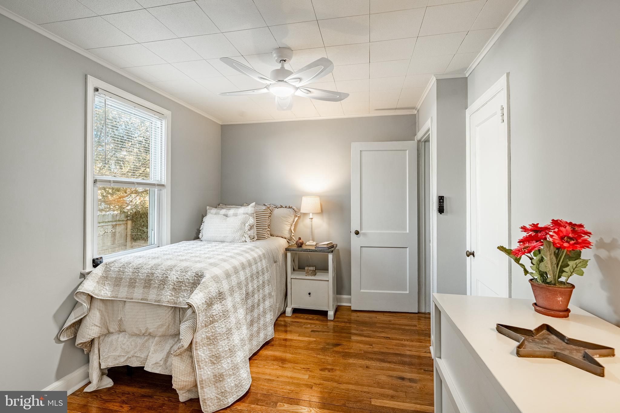 8 Garrett Road Wilmington, DE 19809 - Photo 18 of 37 a bedroom with a bed and a chandelier