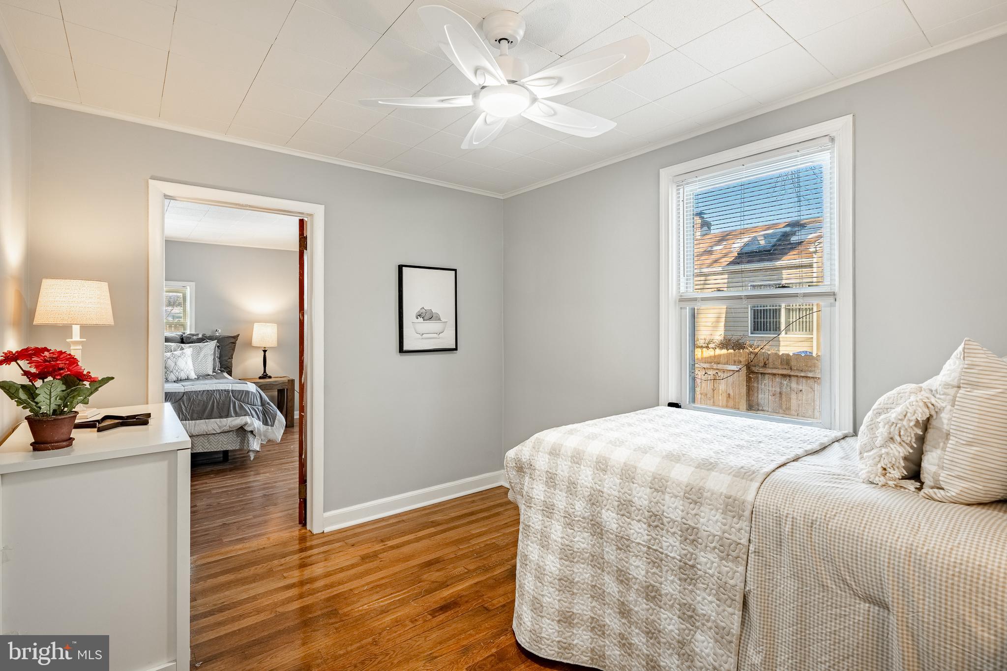 8 Garrett Road Wilmington, DE 19809 - Photo 19 of 37 a bedroom with a bed and a chandelier