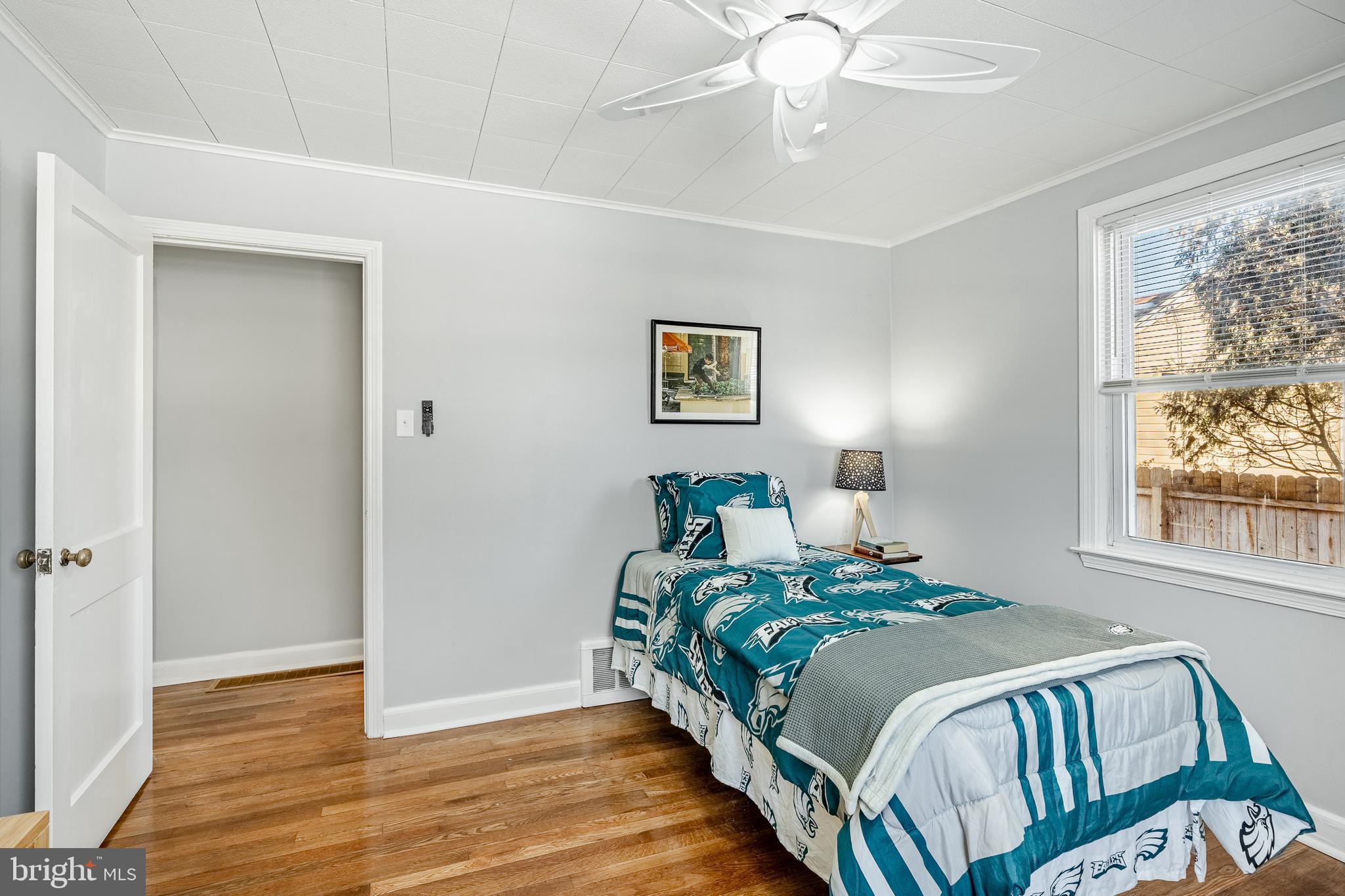 8 Garrett Road Wilmington, DE 19809 - Photo 20 of 37 a bedroom with a bed and wooden floor
