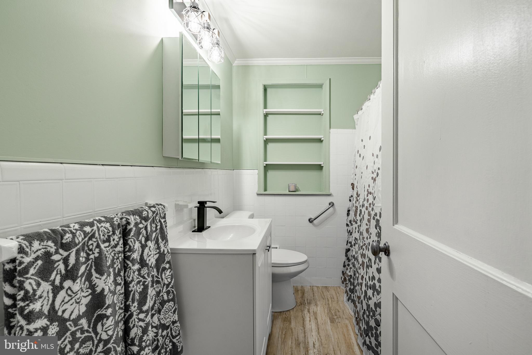 8 Garrett Road Wilmington, DE 19809 - Photo 22 of 37 a bathroom with a sink toilet and shower