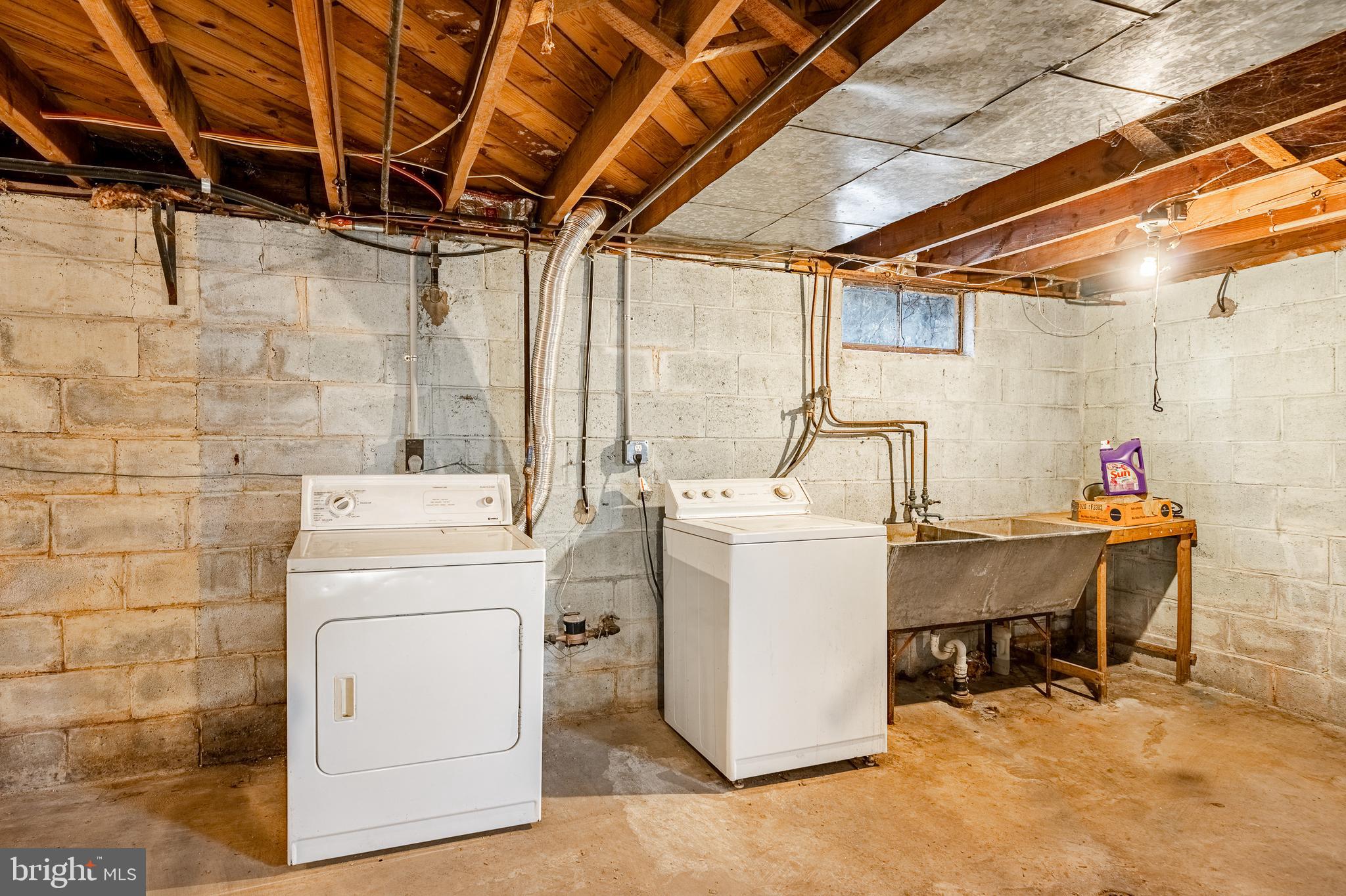 8 Garrett Road Wilmington, DE 19809 - Photo 26 of 37 a storage room with dryer and washer